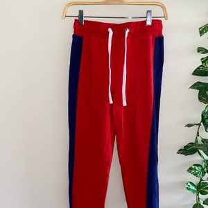Red joggers with blue details